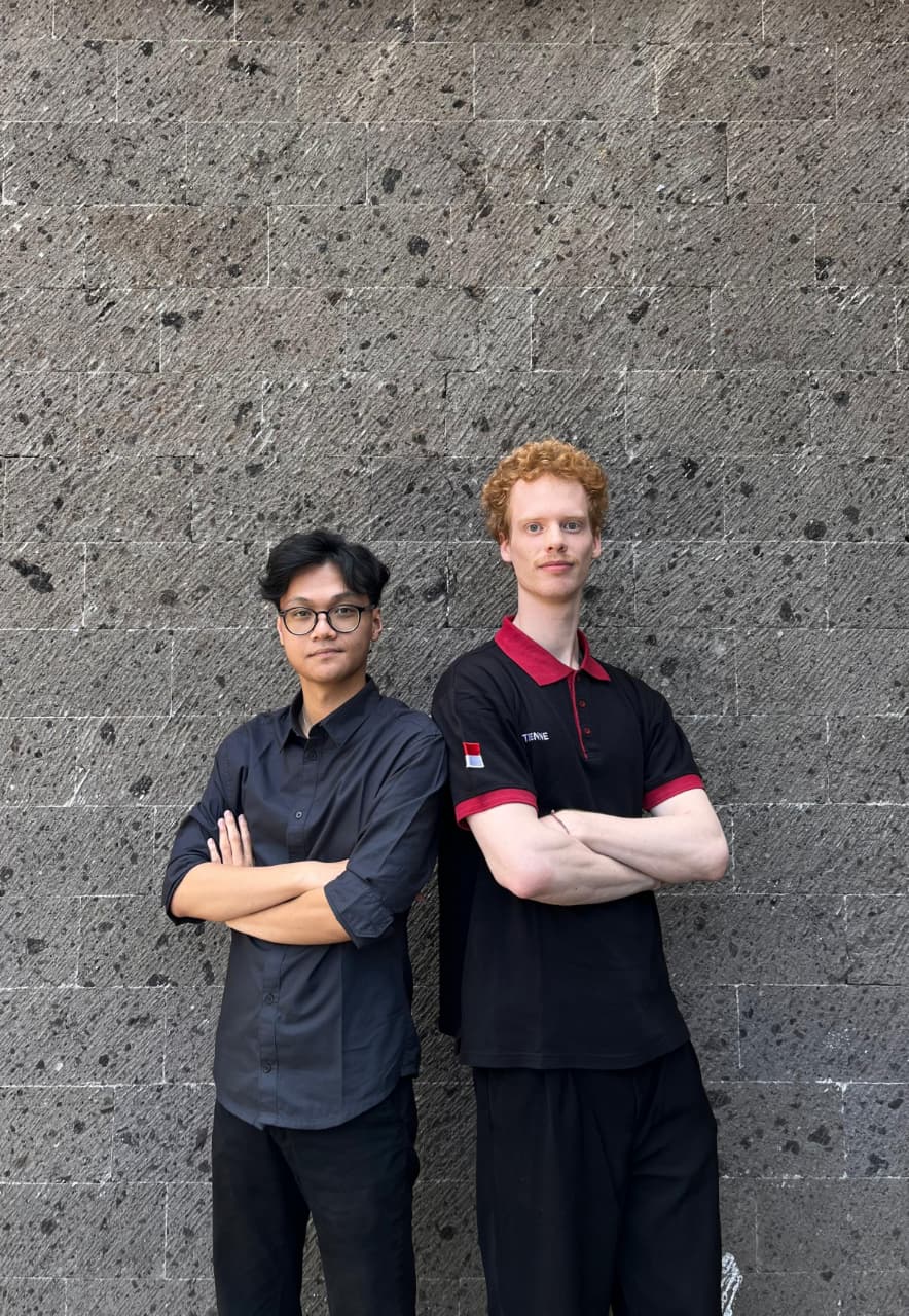 two people standing next to each other
